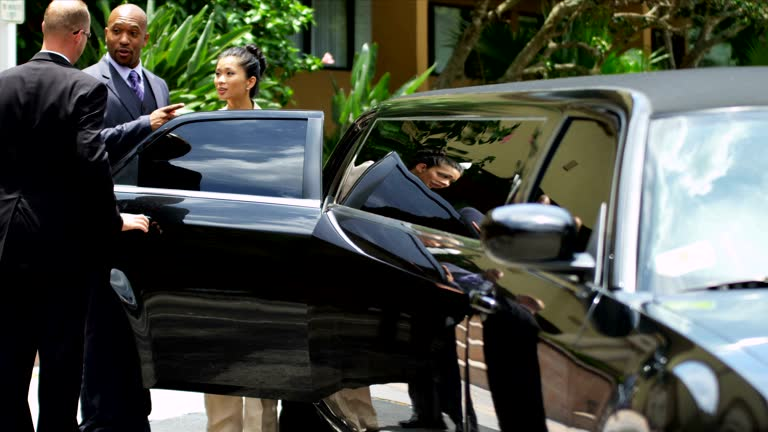  A hand reaches for the door handle of a black car, indicating a rental from Right Black Car Rental Service.